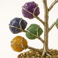Handcrafted chakra balancing crystal tree with multicolor raw stones representing all 7 chakras, perfect for meditation spaces