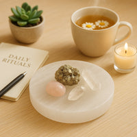 Selenite charging plate on bedside with jewellery